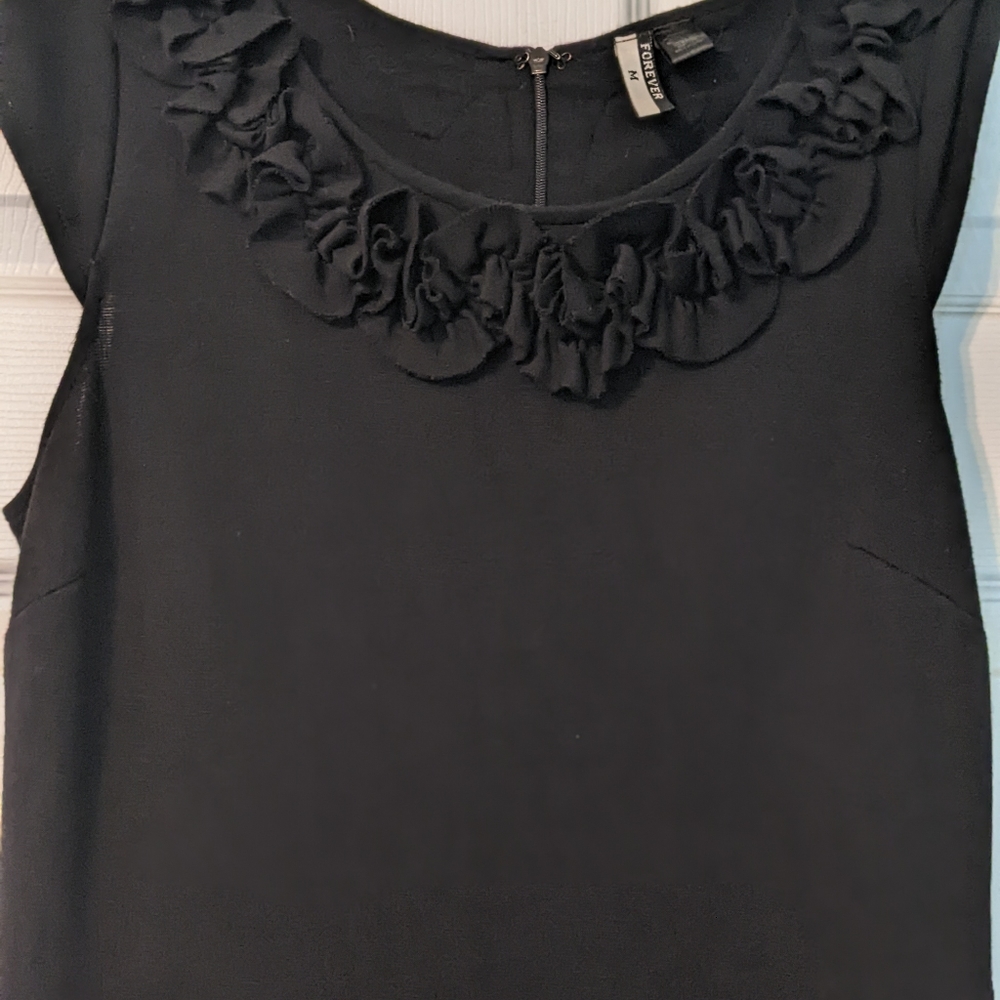 Black dress with ruffled neckline
